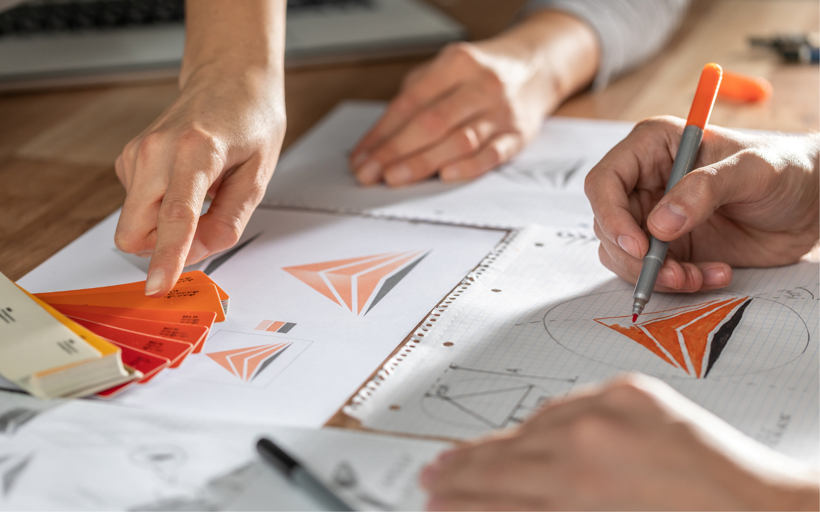 Team brainstorming logo design ideas.