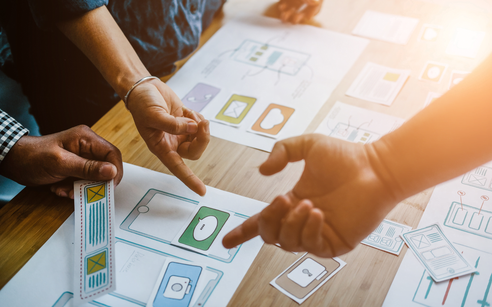 Team designing app interface wireframes.