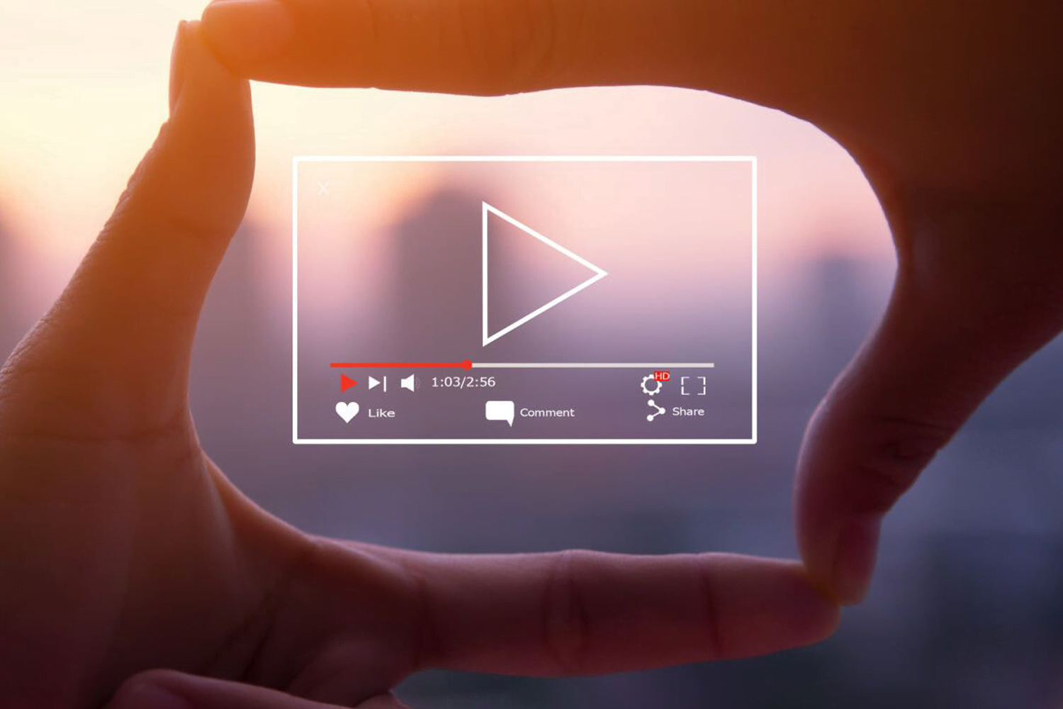 Fingers framing video player screen.